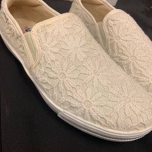 Creme Embroidered Slip Ons